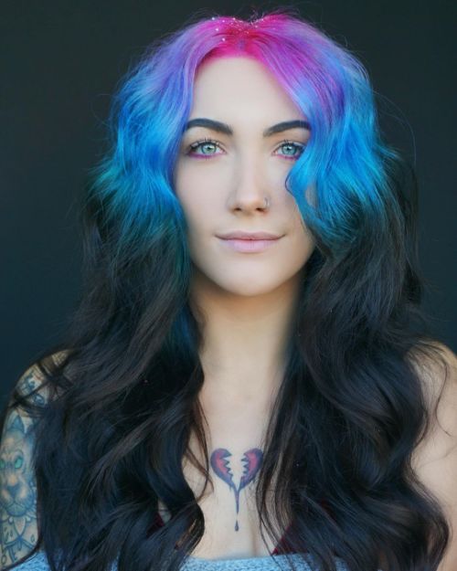 dark hair with blue and pink colored roots