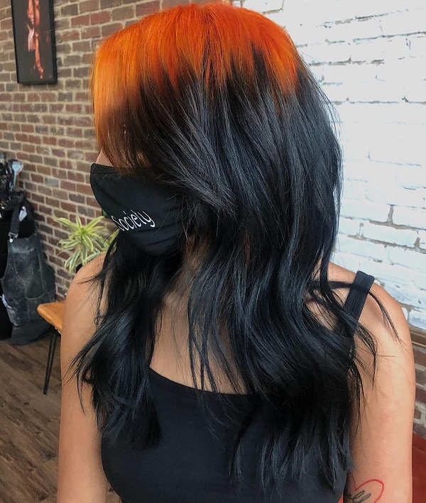 dark brunette black hair with bright colored red roots