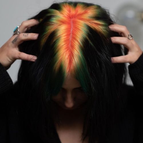 dark black hair color with bleached and brightly colored roots