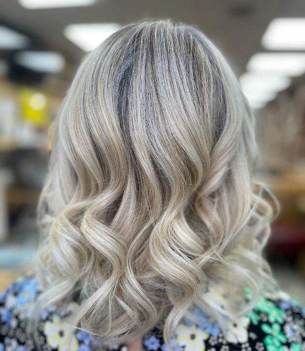 rooted blonde wavy white chocolate hair
