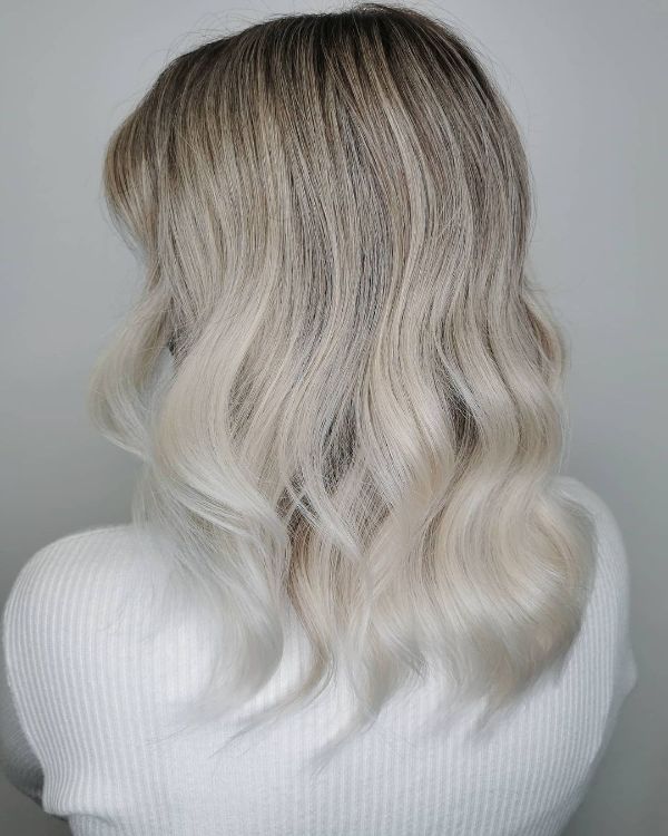 ashy white chocolate hair with darker roots