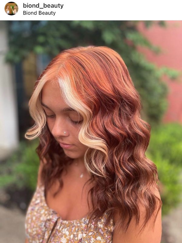 very dark pumpkin spice hair with blonde face-framing highlights