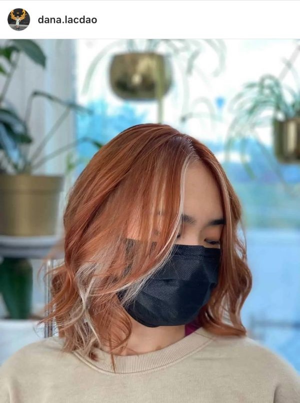 mid-length pumpkin spice hair with front highlights