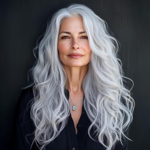 Silver-toned long wavy hairstyle for women over 60