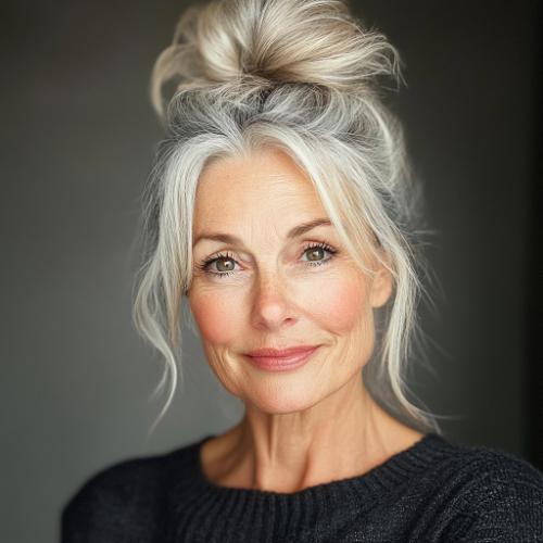 Messy top bun hairstyle for older women over 60