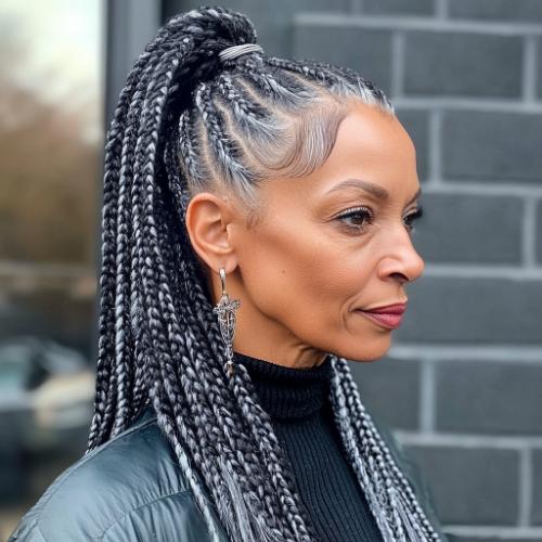 Box braids in a ponytail for an older woman