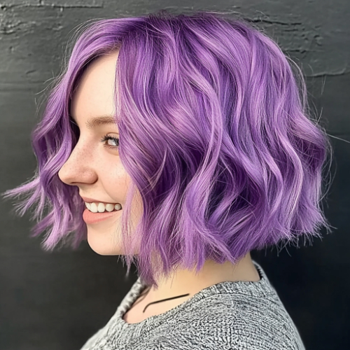 Bold purple bob with asymmetrical cut and vibrant color